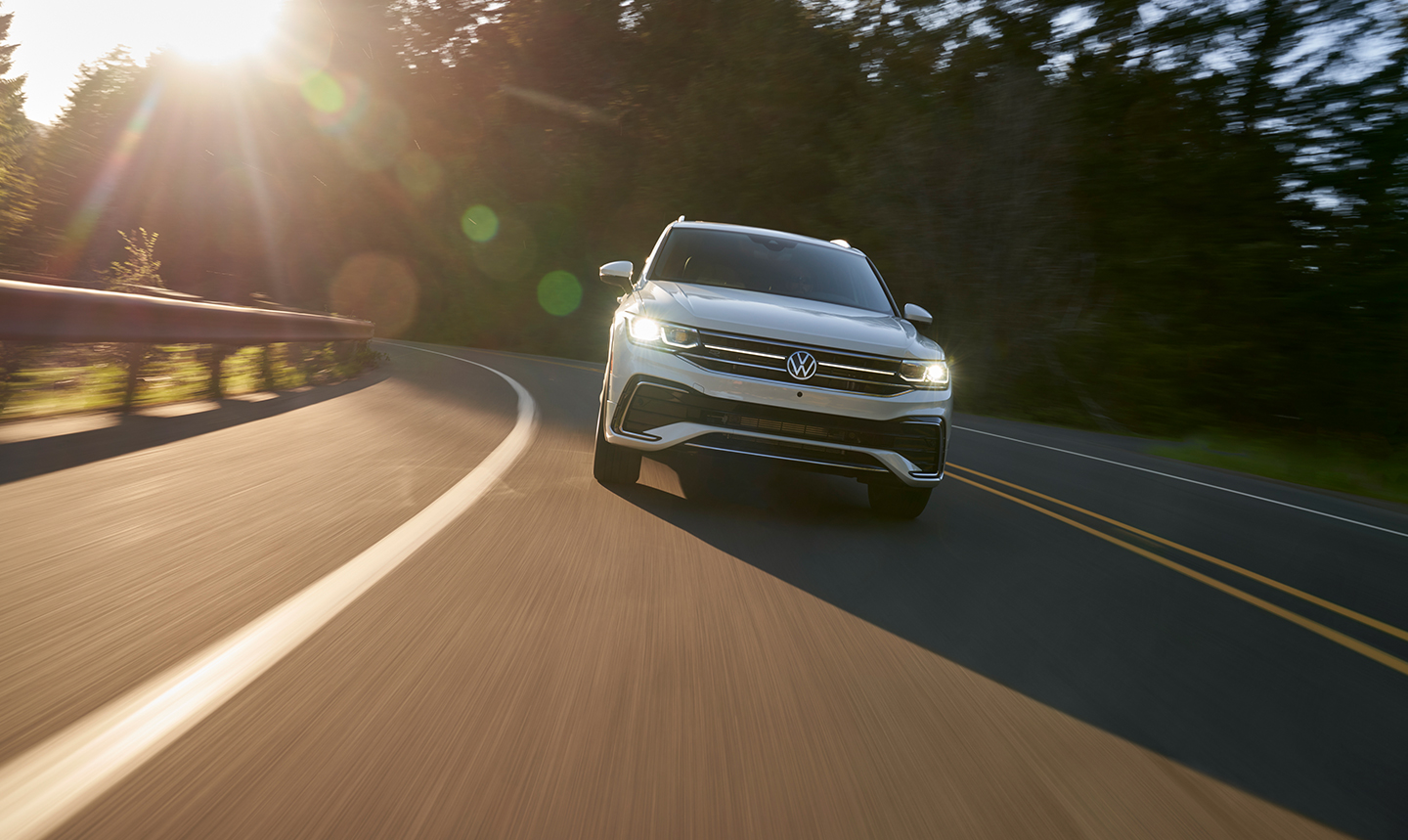 2022 Volkswagen Tiguan driving down a 2 lane highway
